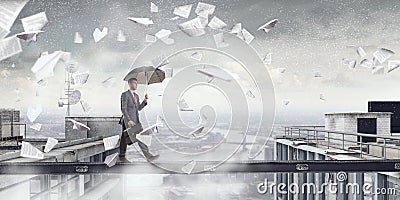 Fearless businessman overcoming difficulty. Mixed media Stock Photo