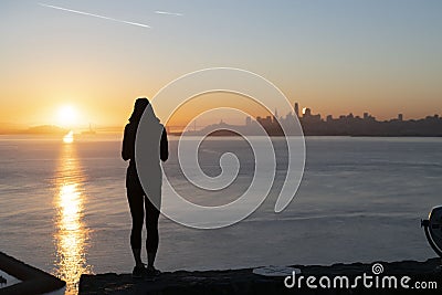 Fearless Young Female Standing Against San Francisco`s Backdrop Stock Photo