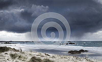 Fearsome giant storm cloud approaching coastline in Brittany, France Stock Photo