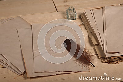 Feather and old papers Stock Photo