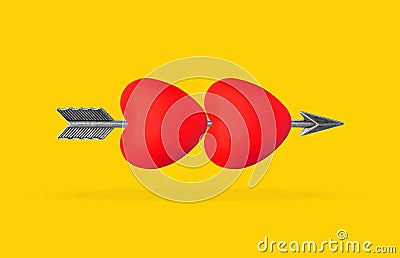 Bow arrow passing through two hearts on yellow Stock Photo