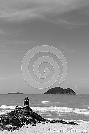 Songkhla, Thailand - Mermaid bronze statue landmark icon of famous Samila Beach seascape in summer season with blue Editorial Stock Photo