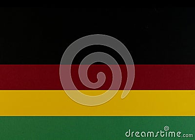 February Black History Month. Brown wooden hand on Paper geometric black, red, yellow, green background. Copy space Stock Photo