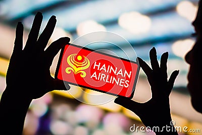 February 4, 2023, Brazil. In this photo illustration, the Hainan Airlines logo is displayed on a smartphone screen Cartoon Illustration