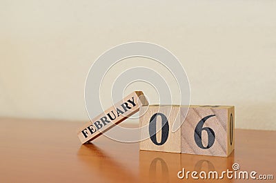 February 06, Date design with calendar cube on wooden table background. Stock Photo