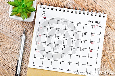 February 2022 desk calendar on wooden table Stock Photo