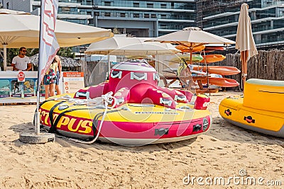 Inflatable entertainment octopus vessel waiting for childs and tourists. Water sport and amusement Editorial Stock Photo