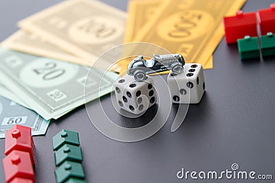 February 8, 2015: Houston, TX, USA. Monopoly car, dice, money, Editorial Stock Photo