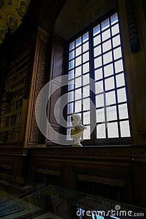 February 2021Parma, Italy: Head sculpture standing in the window across the buildings of Palazzo della Pilotta in Biblioteca Palat Editorial Stock Photo