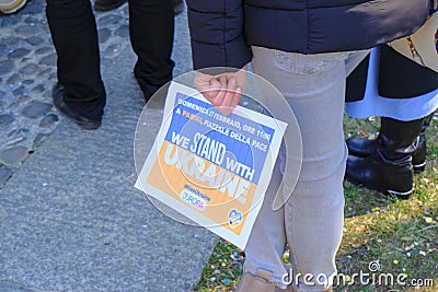 February 2022 Parma, Italy: Stand with Ukraine poster in hands of the person close-up. Demonstration against war. People supportin Editorial Stock Photo
