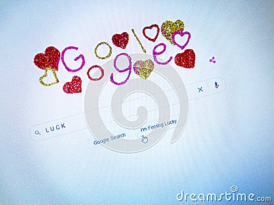 The screen with a Valentine Day style animated home page of the Google search engine Editorial Stock Photo