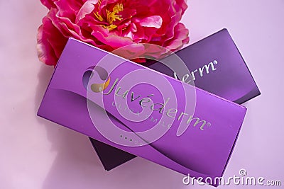 February 25, 2022, Ukraine, clinic needle Kyiv city,illustrative box of Juvederm filler, Allergan company, USA, flower Editorial Stock Photo