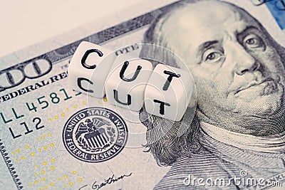 FED, Federal Reserve with interest rate cut concept, small cube block with alphabet building the word CUT next to Federal Reserve Stock Photo