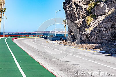 Bikeway along federal highway 11 towards del Ruso viewpoint, sea against blue sky background Stock Photo