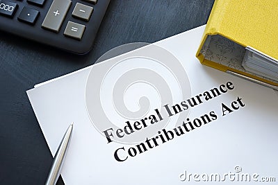 Federal Insurance Contributions Act FICA near yellow folder and calculator. Stock Photo