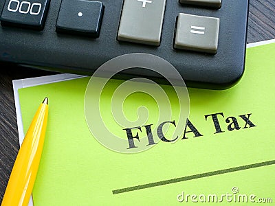 Federal Insurance Contributions Act FICA tax papers and calculator. Stock Photo