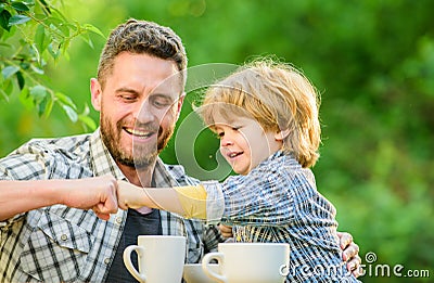 Feed baby. Natural nutrition concept. Fathers day. Best friends. Father and son having fun. Feeding son natural foods Stock Photo
