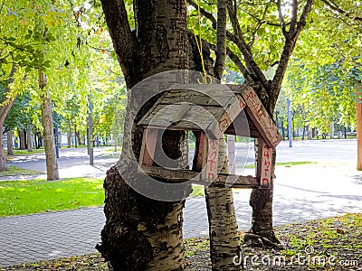 Feeders for birds in the city park. Concept of helping animals Stock Photo