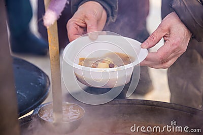 Feeding homeless people on the street Stock Photo