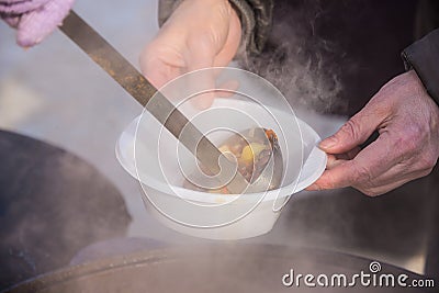 Feeding homeless people on the street Stock Photo