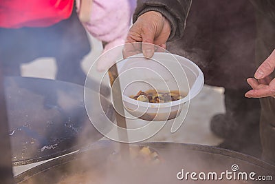 Feeding homeless people on the street Stock Photo