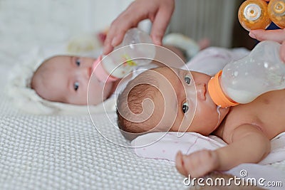 Feeding of twins Stock Photo