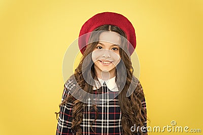 Feel extraordinary. parisian kid french beret. how to wear checkered dress. girl long curly hair. visit to hairdresser Stock Photo