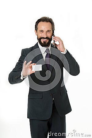 Feel free to call me anytime. Businessman hold plastic blank white card copy space. Businessman carries business card Stock Photo
