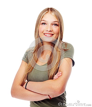 Feeling a bit self-conscious. A beautiful teenage girl with her arms folded. Stock Photo