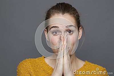 Feeling concept for 20s girl covering her mouth Stock Photo