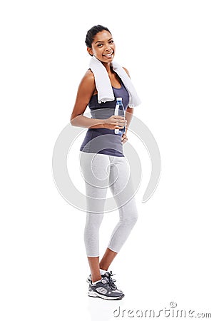 Feeling invigorated after a workout. A young woman holding a bottle of water after an energizing workout. Stock Photo