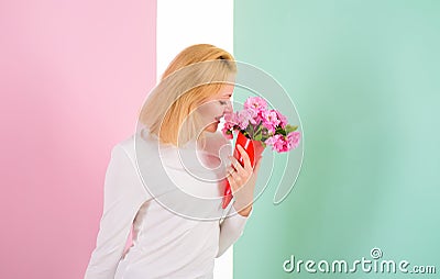 Feeling so special. Girl holding bouquet flowers enjoy favorite fragrance. Woman smiling likes to feel special attend to Stock Photo