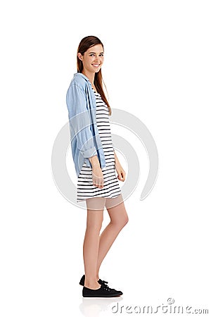 Feeling stripey today. Studio shot of a beautiful young woman wearing a striped dress against a white background. Stock Photo