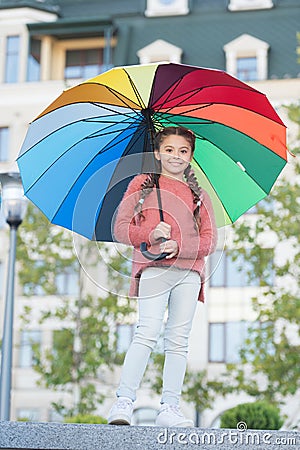 Feeling warm. Optimist and cheerful child. Spring warm. Positive mood in autumn warm weather. Multicolored umbrella for Stock Photo