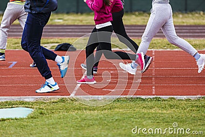 feet of athletes on a track Stock Photo