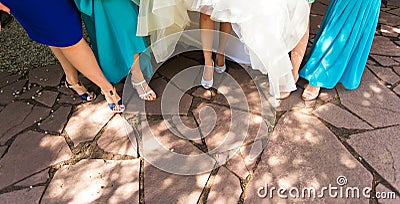 Feet of a bride and her bridesmaids Stock Photo