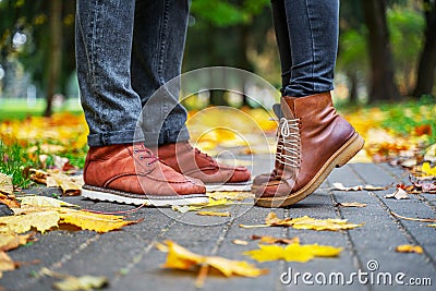 Feet of a couple in love in brown shoes Stock Photo