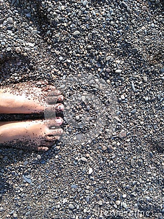 Feet exposed to fine sand on the beach, the sand is very beautiful Stock Photo