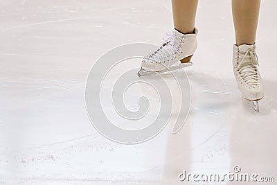 Feet of Figure Skater on Ice Stock Photo