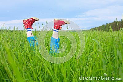 Feet in gym shoes and hungry mosquitoes Stock Photo