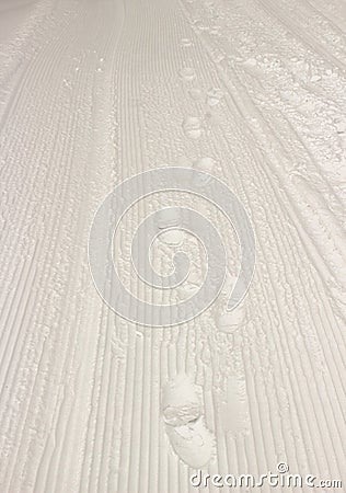 Feet imprint on snow Stock Photo