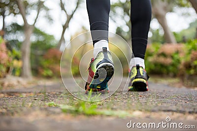 Feet of jogger jogging Stock Photo