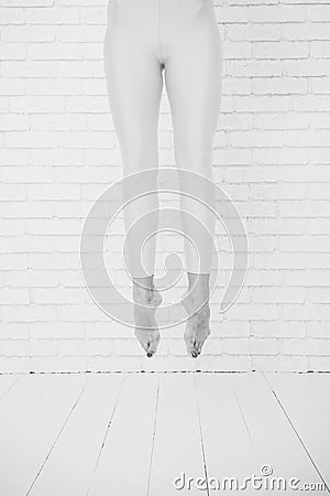 Feet jump. Her ambition knows no bounds. Ballet dancers feet. High jump. Her great ambition is to be a dancer Stock Photo