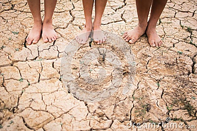 Feet people on cracked dry ground Stock Photo