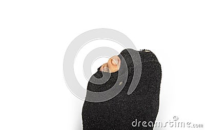 Feet of poor pensionist. Holes in the sock Stock Photo