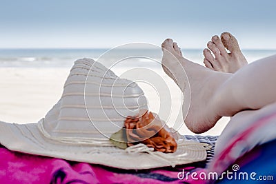 Feet resting at the beach Stock Photo