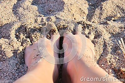Feet in the sand Stock Photo