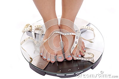 Feet scales tape blue toenails Stock Photo