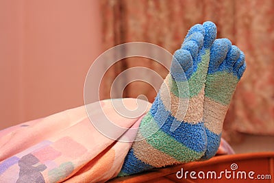 Feet with striped socks Stock Photo