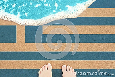 Feet on the sunny sandy beach with flag. View from top on surf Stock Photo